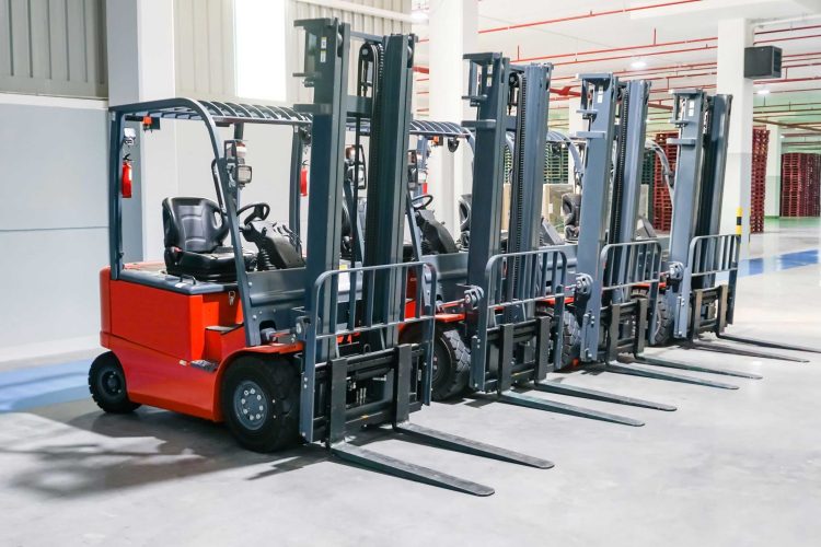 Four red standard counterbalance forklifts for sale